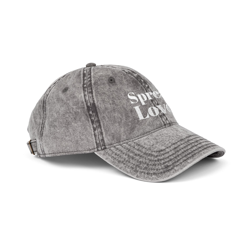 Minimal washed grey dad cap with premium white "Spread Love." embroidery on the front. A timeless streetwear essential made for everyday comfort, positivity, and effortless style.