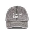 Minimal washed grey dad cap with premium white "Spread Love." embroidery on the front. A timeless streetwear essential made for everyday comfort, positivity, and effortless style.